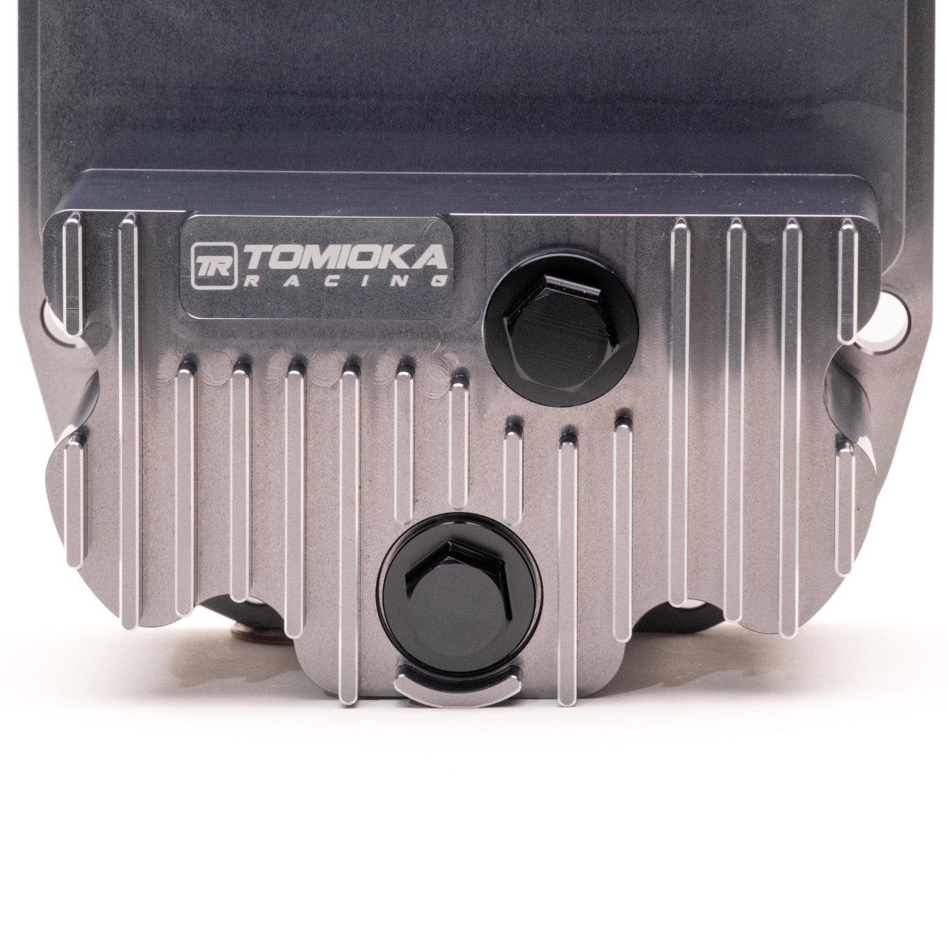 Machined finned cooling on Tomioka Racing R160 differential cover. Magnetic M20 drain and fill plugs on R160 rear diff cover. Tomioka Racing logo and Anodized Gunmetal Blue finish on R160 diff cover