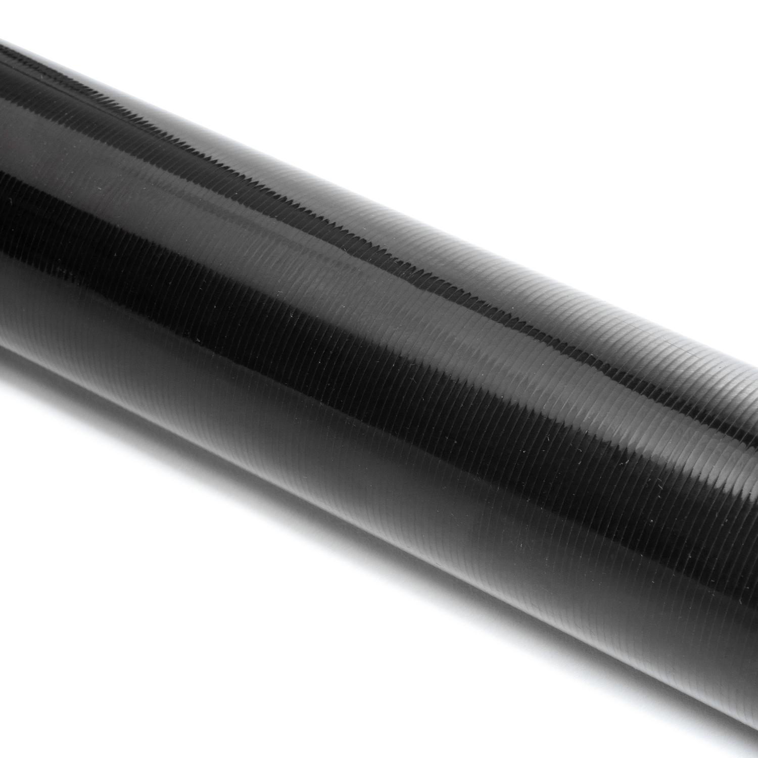 Close-up of the Toray T700 carbon fiber weave on the Tomioka Racing TR-DS1000 driveshaft tube